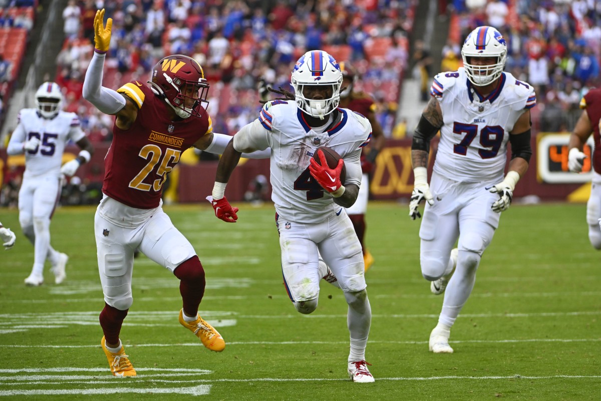 Sep 24, 2023; Landover, Maryland, USA; Buffalo Bills running back James Cook (4) runs past Washington Commanders cornerback Benjamin St-Juste (25) during the second half at FedExField.